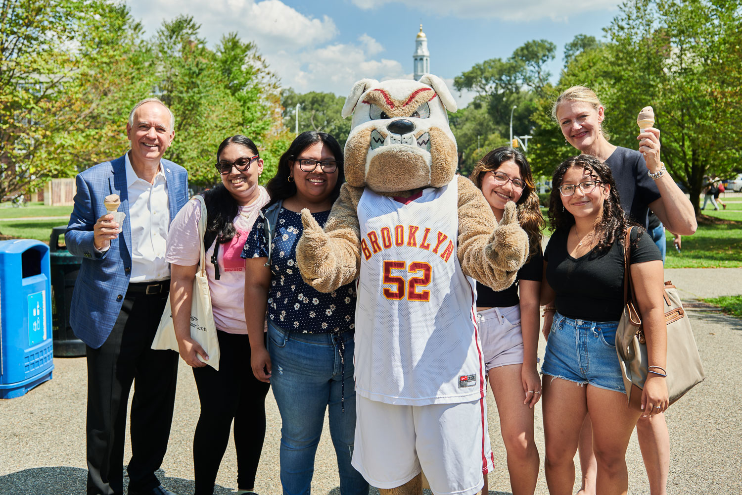 CUNY Chancellor Félix V. Matos Rodriguez help students ring in the first day of classes with President Michelle J. Anderson, Buster the Bulldog, and an outdoor ice cream social.
