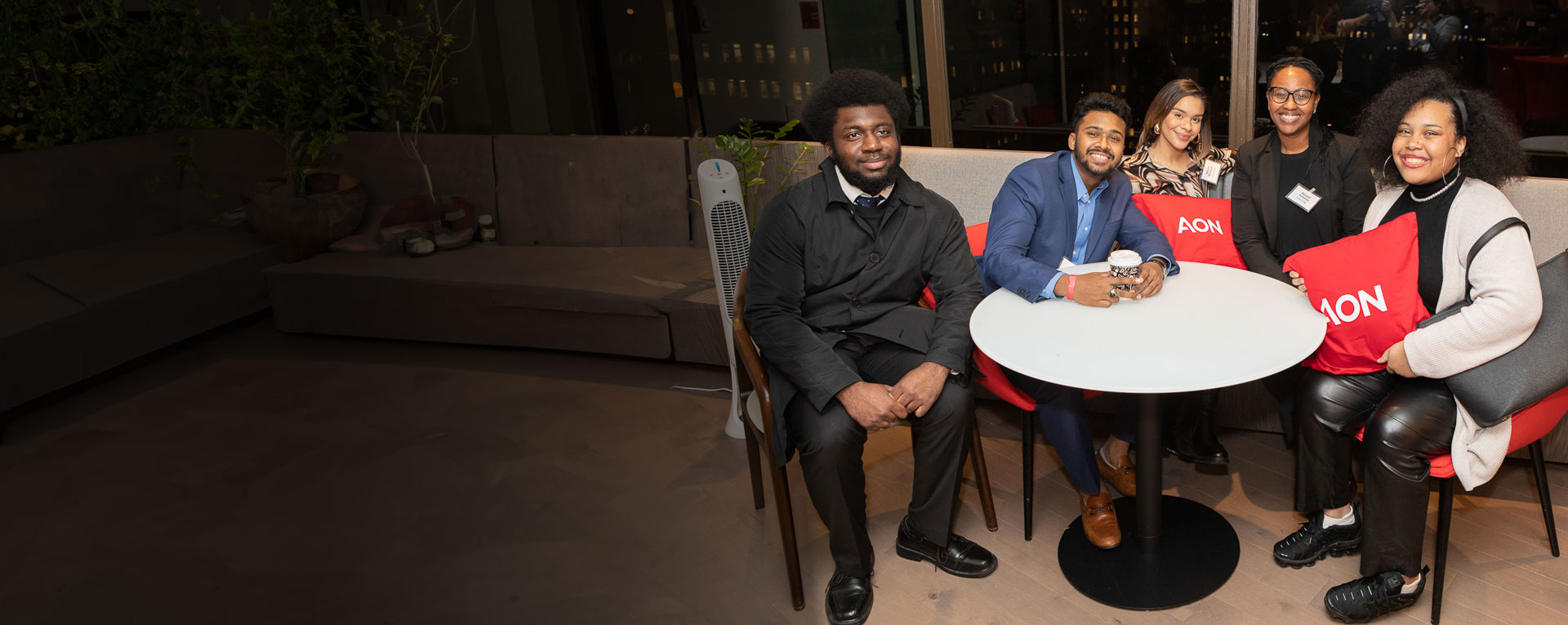 Students gathered at the New York City headquarters of Aon plc for a reception