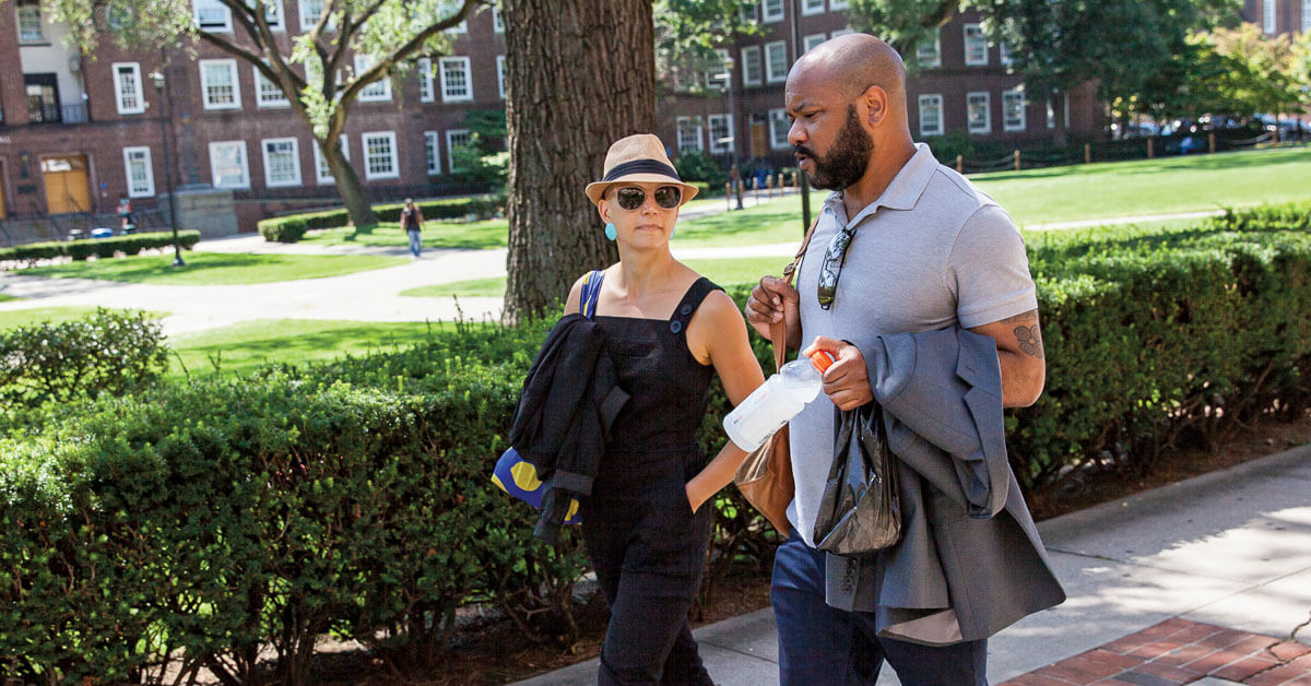 Helen Phillips ’07 M.F.A. and De’Shawn Charles Winslow ’11, ’13 M.A. walking across campus