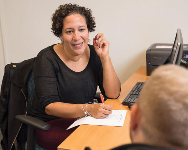 Luz Medrano, a staff attorney from CUNY Citizenship Now!, a free legal assistance program available to CUNY students, at the Immigration Student Success Office in Roosevelt Hall.