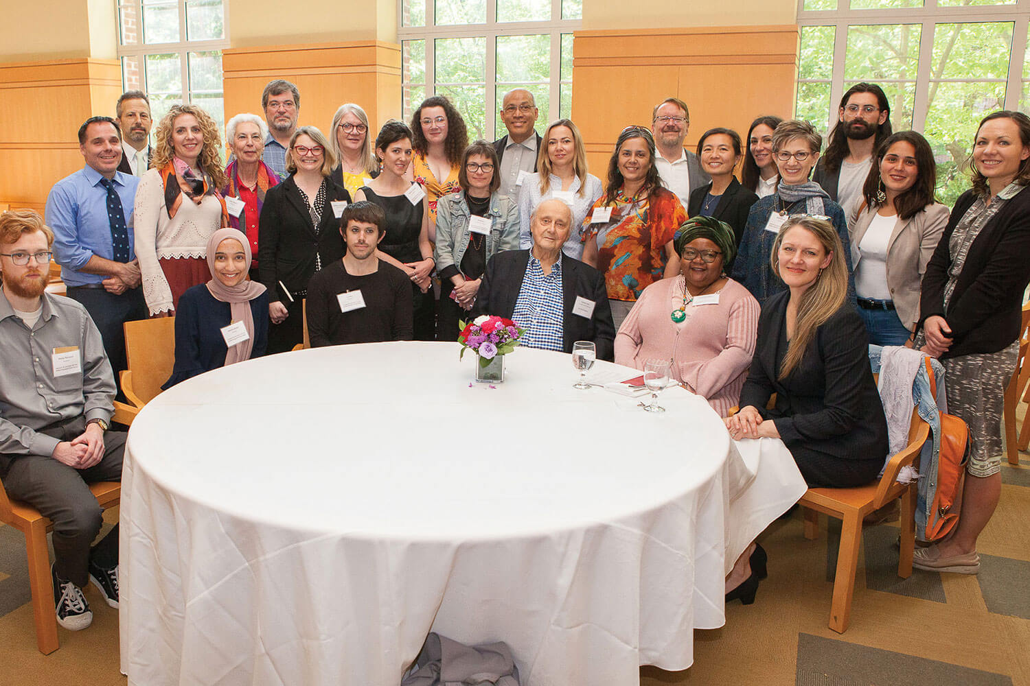 Leonard Tow ’50, seated third from right with President Michelle J. Anderson, at right, faculty, and students at the Leonard ’50 and Claire ’52 Tow Student and Faculty Research Travel Fellowships Luncheon in May.