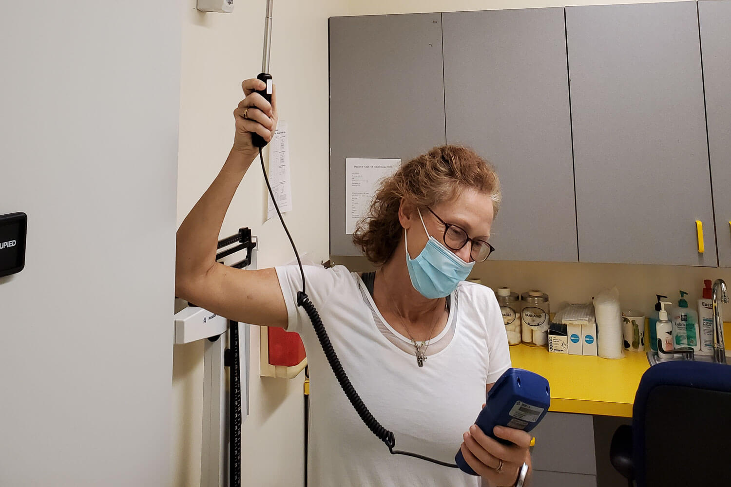 Carrie Sadovnik, COVID-19 Response Team Chair and Director of Environmental Health and Safety, testing air quality. She has been instrumental in preparing the campus for re-entry.